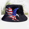 Detail of black bucket hat featuring American flag eagle print on a vacation backdrop - Flag Eagle Print (Eagle)