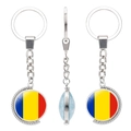 Rotating metal keychain with Romania flag color glass gem and world map detail - Romania