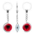 Rotating silver metal keychain featuring Albania flag and black double-headed eagle - Albania