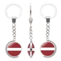 Rotating silver keychain featuring Lithuania flag glass cabochon pendant on white background - Lithuania