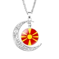 Silver hollow moon pendant necklace featuring North Macedonia flag glass cabochon - North Macedonia