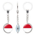 Rotating metal keychain with Indonesia flag pendant and double-sided glass dome - Monaco