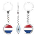 Rotating keychain featuring the Netherlands flag with a polished silver alloy finish - Netherlands Style