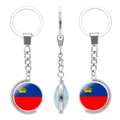 Rotating metal keychain with double-sided Liechtenstein flag glass gem pendant - Liechtenstein