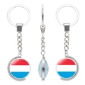 Rotating double-sided keychain featuring Netherlands flag with silver beaded edges - Luxembourg