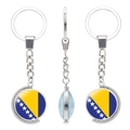 Rotatable metal keychain with Bosnia and Herzegovina flag glass pendant on white background - Bosnia and Herzegovina Flag
