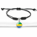 Adjustable black braided rope bracelet featuring Gabon flag glass gem pendant charm - Gabon