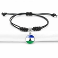 Adjustable black woven bracelet featuring Central African Republic flag gemstone charm - Lesotho