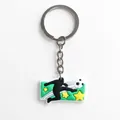 Soccer ball keychain with athlete silhouette and yellow star in green PVC soft rubber - Athlete Silhouette Soccer Style (YSK323-06)