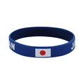 Blue silicone sports bracelet with Japan flag icon and bold white Japan lettering - 9 Japan Blue