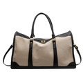 Large beige canvas duffel bag with black leather accents and golden hardware - Black