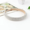 Elegant silver padded headband featuring sparkling rhinestones with a beige inner lining - Medium Version / White Zircon