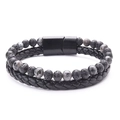 Detail of double-layer men's bracelet with braided black leather, lava stone and magnetic clasp - Flash Stone + Lava Stone