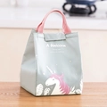 Blue unicorn insulated lunch bag with pink handles for office meals on wooden table - Gray Unicorn