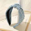 Detail of light blue denim knotted headband featuring sparkling rhinestones and studs - Light Blue