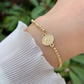 Detailed view of 18K gold plated bead bracelet with religious virgin mary medal charm - Oval Religious Relief Style