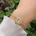 Elegant 18K gold-plated beaded bracelet featuring a Virgin Mary zircon pendant on wrist - Rhinestone Bordered Virgin Mary Style