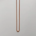 Detailed view of the vibrant orange resin bear pendant necklace box chain structure - Elegant Coffee