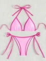 Flat lay of pink two-piece bikini set with contrast trim on white textured backdrop - Light/Dark Pink