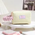 Pale yellow quilted heart makeup bag with pink pleated handle and Sweet Dream patch - Large / Yellow