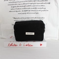 Detail of black corduroy cosmetic pouch with May Rabbit label and metal zipper ring - Black