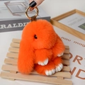 Detail of soft orange plush bunny keychain with fluffy texture and gold metal ring - Large / Orange