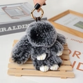 Fluffy dark gray plush rabbit keychain with gold metal clasp and white paw details - Large / Mixed Black