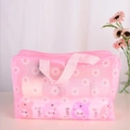Pink semi-transparent daisy PVC makeup bag with reinforced pink webbing handles - Pink