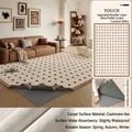 Washable caramel chenille rug with black polka dots on beige faux cashmere surface - Removable And Washable Faux Cashmere - Caramel Wafer