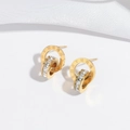 Macro detail of gold-plated double hoop earrings with Roman numerals and white zircons - Stud Earrings / Gold