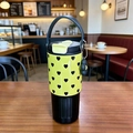 Yellow stainless steel travel mug with black heart patterns and carry handle - Black & Yellow Heart