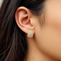 Elegant gold geometric earrings with full diamond pave setting shown on a model - Gold