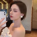 Elegant set with oversized pearl stud earrings and a delicate pearl pendant necklace - Half-round Pearl Stud Earrings - E4812 White