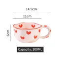 Handcrafted white ceramic wave mug with red heart patterns and 300ml capacity mark - Wavy Edge Mug / Pink Background Heart