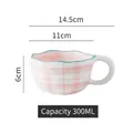 Pink and white checkered ceramic mug with blue wave rim and 300ml capacity - Wavy Edge Mug / Pink Plaid