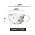 Irregular white ceramic mug with red hearts, wavy rim and 300ml capacity measurement - Wavy Edge Mug / Small Heart
