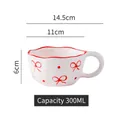 Irregular white ceramic wave mug with red bow and polka dots, 300ml capacity - Wavy Edge Mug / Bow