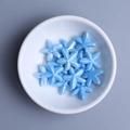 Sky blue starfish glazed ceramic beads for DIY jewelry making in a white bowl - Lake Blue