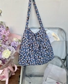 Blue floral canvas tote bag with shoulder strap displayed on a modern chair - Blue Daisy(33#)