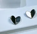 Detailed close-up of 3D geometric silver heart stud earrings with faceted metal design - 3D Cut Heart-Silver