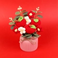 Handmade crochet apple flower bouquet in a pink pot with green leaves and a bow - Apple Style