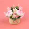 Detailed view of handmade crochet rose and daisy flowers in a Life Life pot - Gradient Glitter