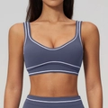 Slate blue brushed yoga sports bra with high-waist leggings and white piping accents - Dark Blue