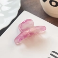 Pink marble acetate hair claw clip with elegant swirl pattern on a white display card - Peach Pink