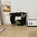 Detail of butterfly embroidery on black jacquard cosmetic bag with metal zipper - Golden Butterfly Embroidery