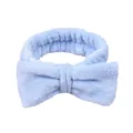 Soft sky blue plush bow headband for face washing and skincare routines on white background - Blue