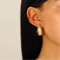 Gold teardrop earring and zircon snake ear cuff set on model's ear - Copper / Waterdrop Stud and Wave Cuff 2-Piece Set / KC Gold