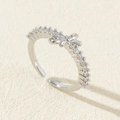 Minimalist adjustable silver ring featuring a cute bow design and sparkling zircons - Style 36