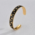 Golden C-shaped open bracelet featuring black enamel star and moon patterns with zircons - Black
