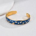 18K gold plated C-shaped cuff bracelet with blue enamel moon and star patterns - Blue